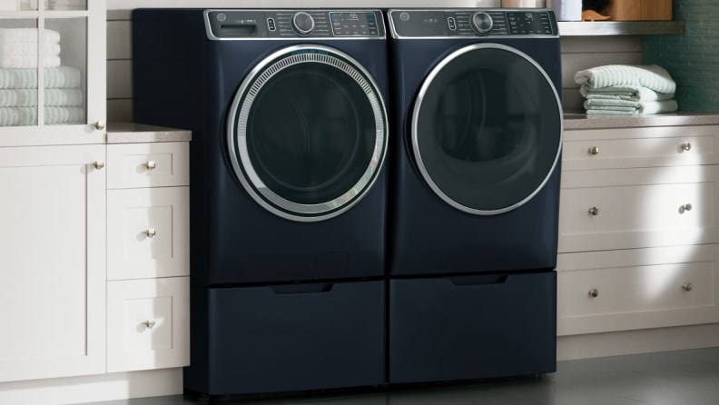 Images of a GE washing machine and dryer in a laundry room.