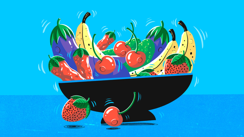 A cartoon bowl of vibrating strawberries, cherries, peppers, eggplants, cucumbers and bananas.