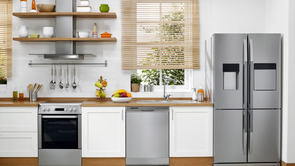 A shot of a modern kitchen filled with brand new, stainless steel appliances.