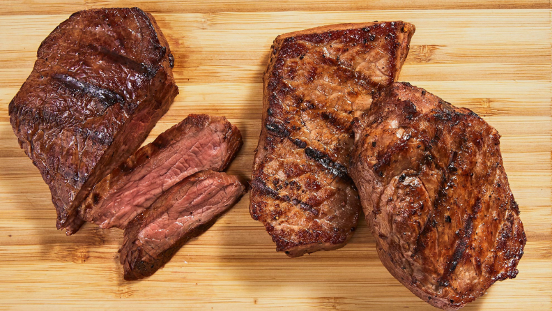 Cooked steak on a wooden cutting board