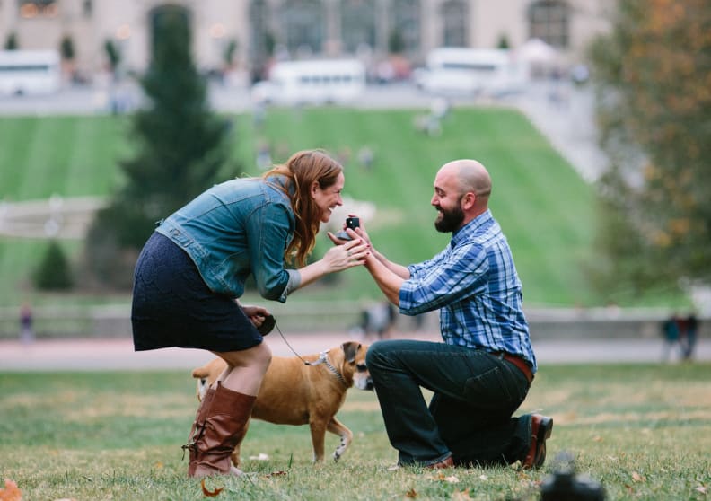 Woman surprised at man down on one knee