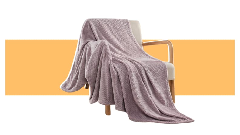 A tan Newscosplay blanket on a chair.