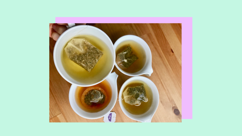 Four mugs of various teas shot from above.