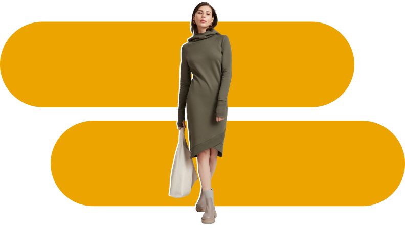 A woman in a Marcella sweatshirt dress.