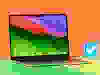 The Apple MacBook Air 13 M3 with a colorful desktop on display sitting next to the Reviewed checkmark.