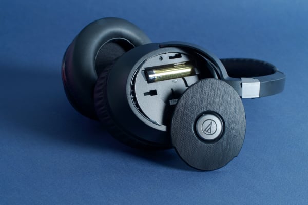Under the Audio-Technica ATH-ANC70 QuietPoint's right ear cup, you'll find a slot for a AAA battery.