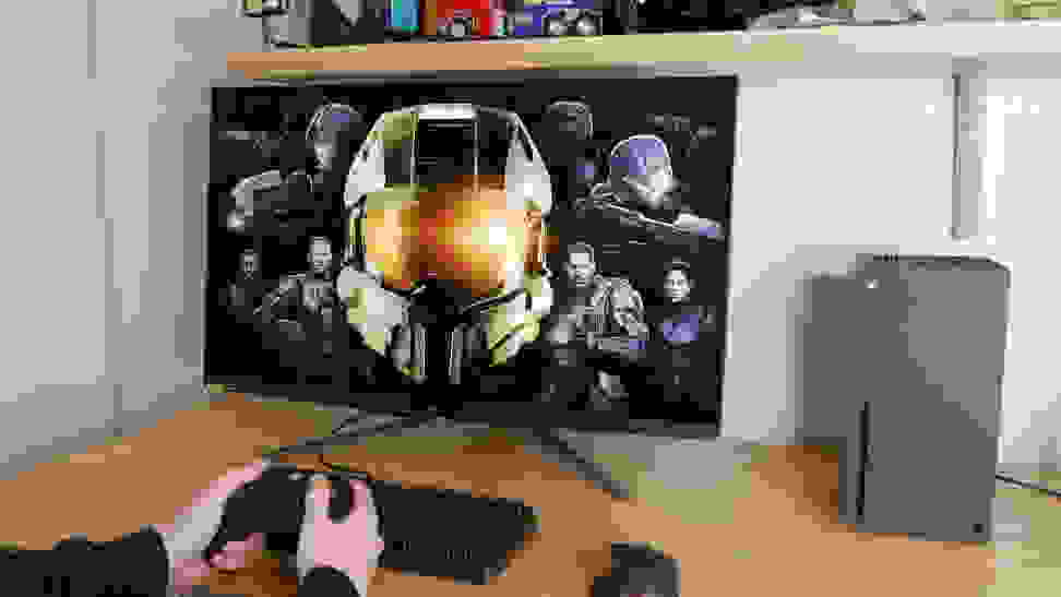 A 4K monitor being used with an Xbox Series X sits on a desk.