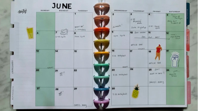 A Happy Planner on the month of June with writing