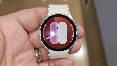 Close-up of a hand holding the Samsung Galaxy Watch7.