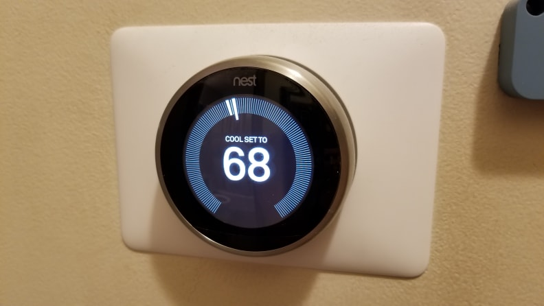 The Nest Learning Thermostat displays the temperature indoors.