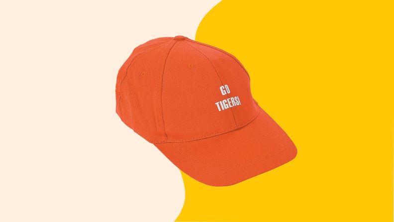 An orange cloth baseball cap that says 
