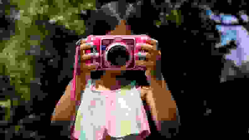 A child takes a photo with a KidiZoom camera