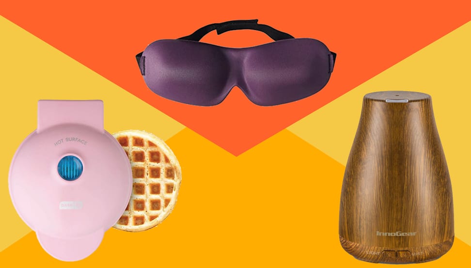 Pink waffle maker, purple eye mask, wooden design air purifier on yellow/orange background