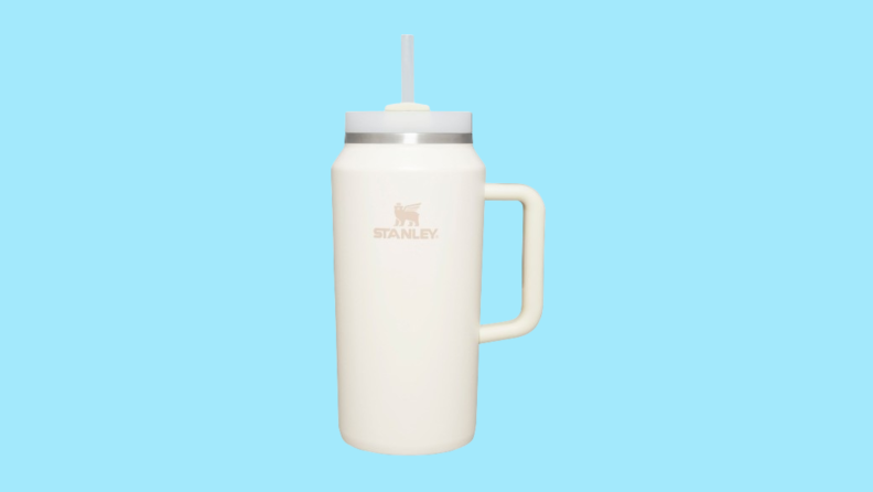 White, 64-oz Stanley cup against blue background
