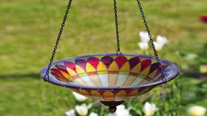 This stunning glass bird bath is a perfect gift for gardeners.
