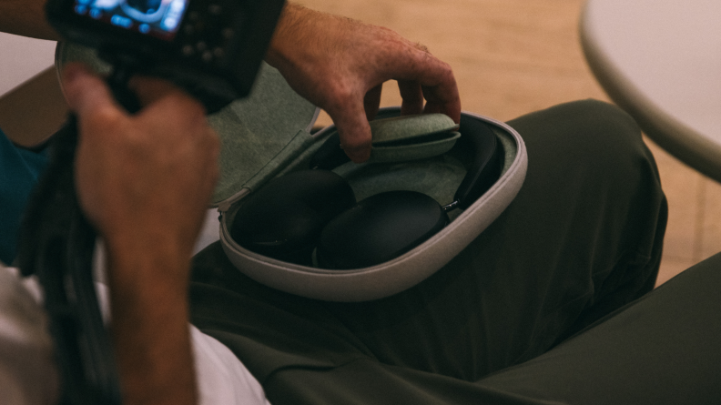 The Sonos Ace headphones folded flat in a travel case