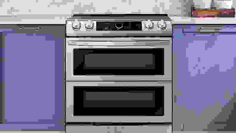 Close up of a Samsung electric range in a blue kitchen.