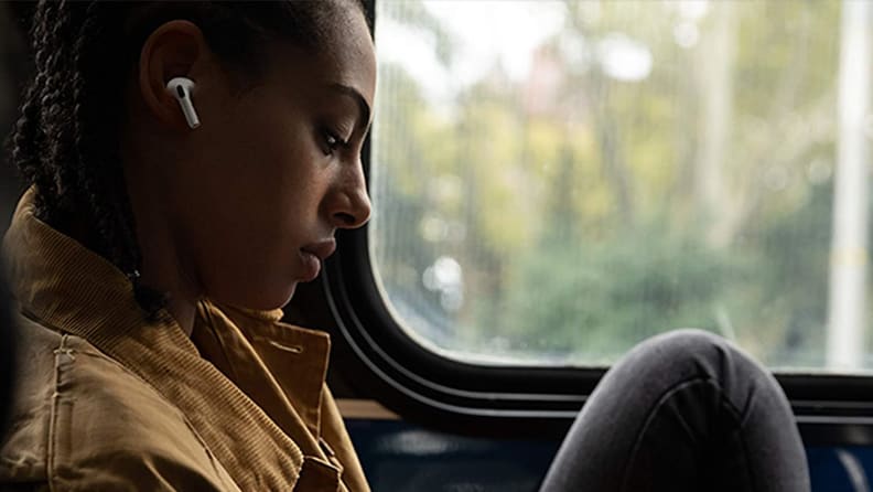 A person listens to music with Apple AirPods Pro.