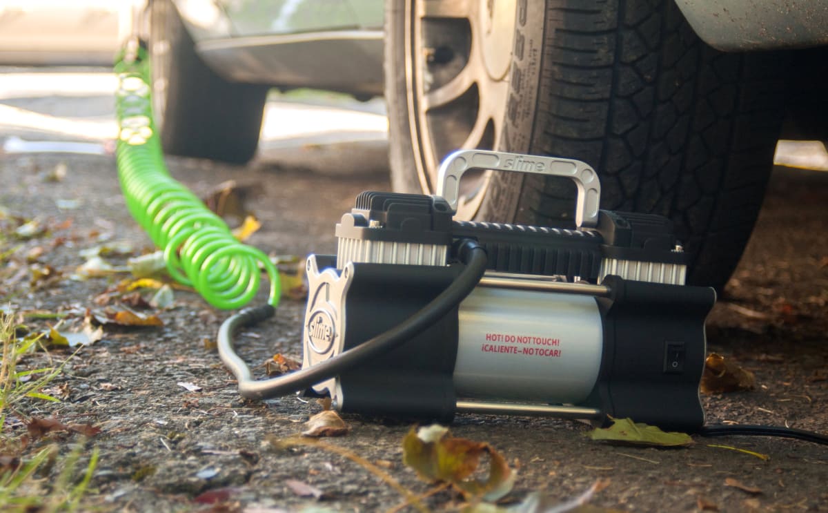 Portable air inflator for tires clearance