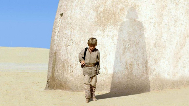 Anakin Skywalker with Darth Vader's shadow behind