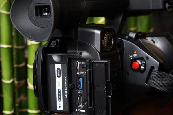 The back of the camcorder features hidden ports to connect your camera to other devices.