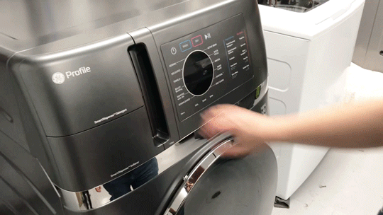 A GIF showing off someone pulling out the lint trap from the GE washer-dryer combo.