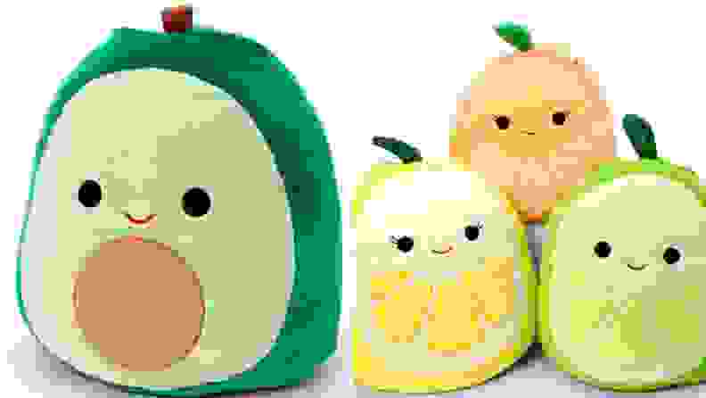 An avocado and three citrus Squishmallows