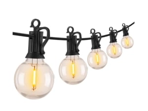 White string lights on evergreen garland above a string of colored lights