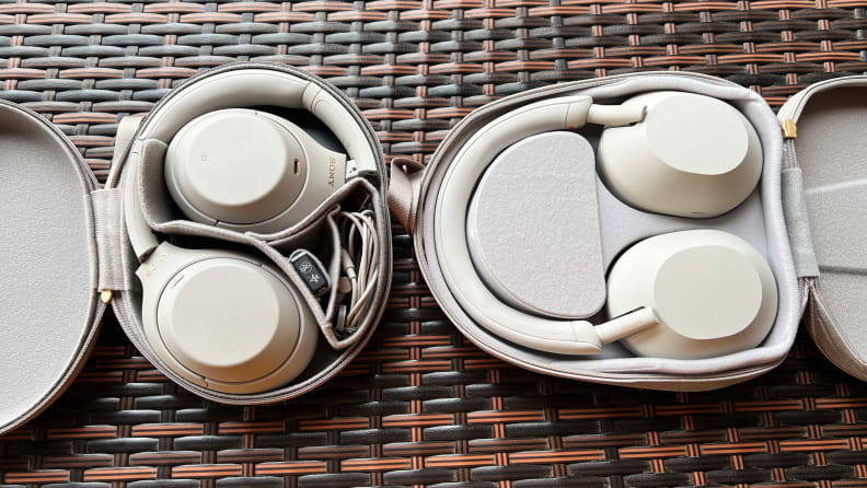 The Sony WH-1000XM4 (left) and WH-1000XM5 set side by side on a ribboned bar top.