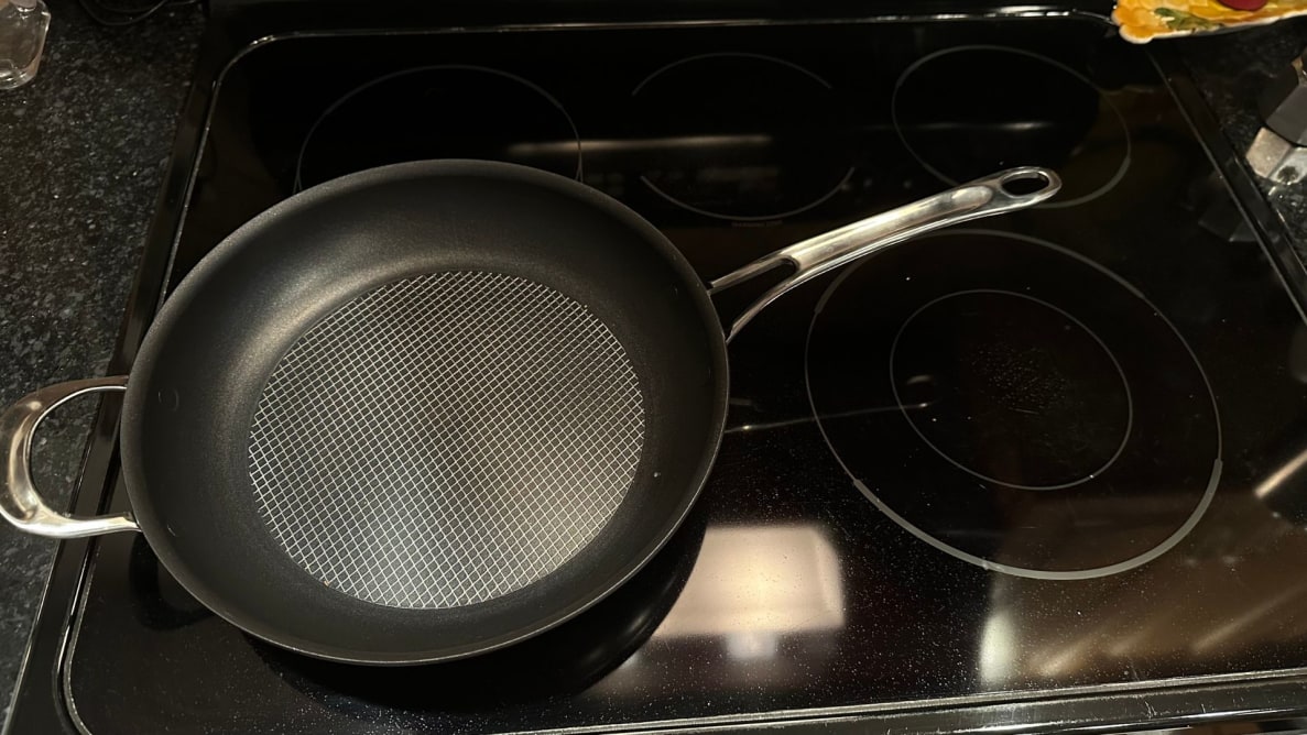 The Anolon X frying pan on an electric cooktop