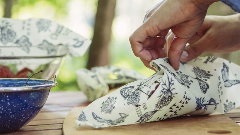 Wrapping food in beeswax wrap.