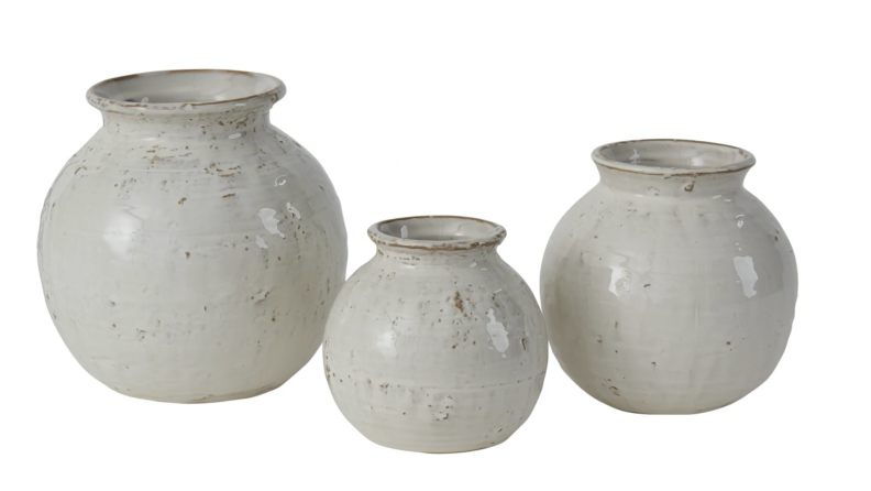 Three ceramic white pots.