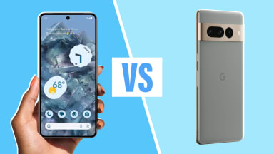 A person holding a Google Pixel 7 Pro next to a Google Pixel 8 Pro smart phone.