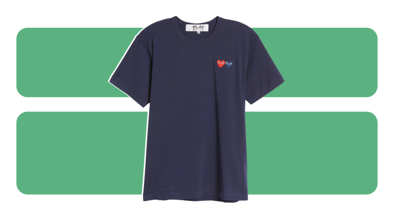 A navy t-shirt with embroidered heart emblems on the chest.