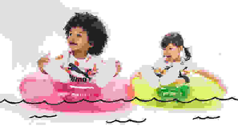 Two toddlers sit on tubes on a cartoon lake, the left toddler is a Black baby girl wearing white sneakers and a white tshirt, and the right toddler is a white girl with brown big tails