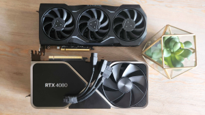 The Nvidia RTX 4080 and the AMD Radeon RX 7900 XTX side by side on a desk.