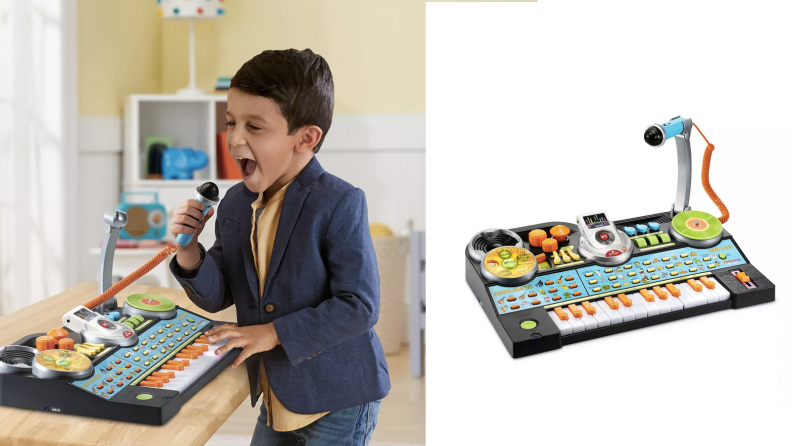 A kid playing with a toy keyboard