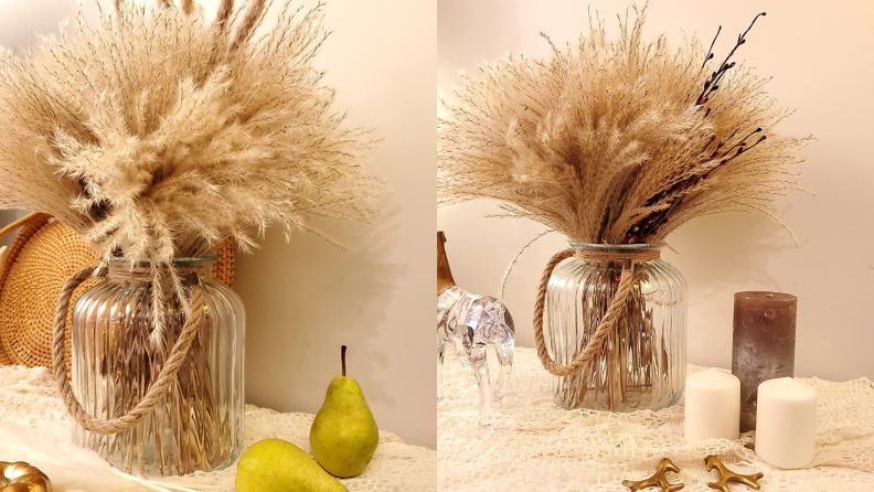 Dried pampas in glass jar on table next to pears and candles.