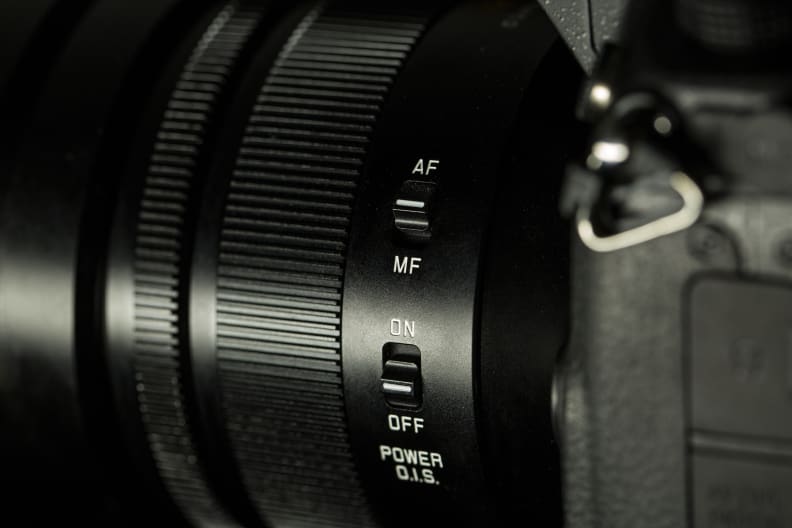 The Nocticron has manual switches to control both focusing mode and optical image stabilization.