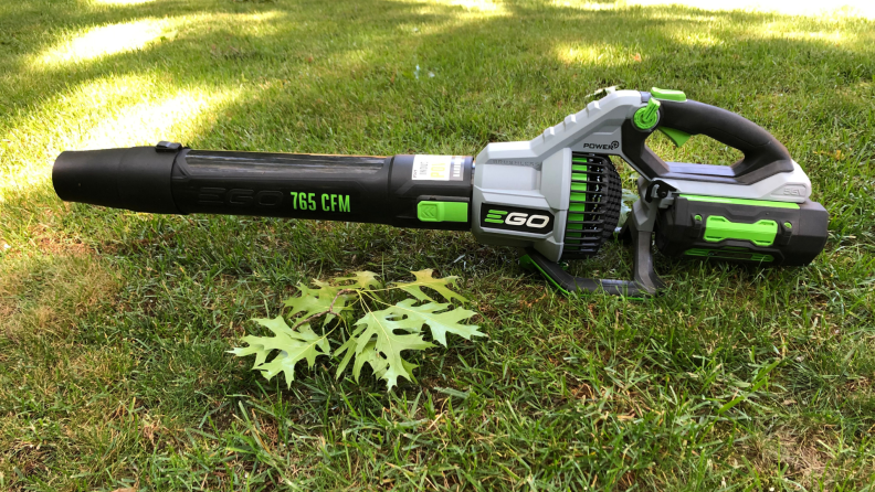 The Ego Power+ LB7654 leaf blower sits on grass