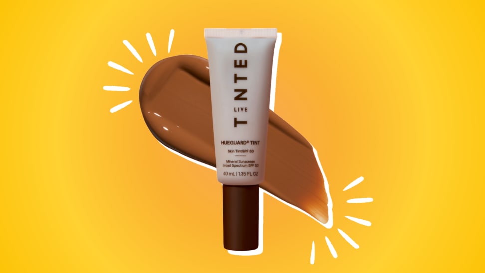 Live Tinted Hueguard Sunscreen against an orange and yellow background.