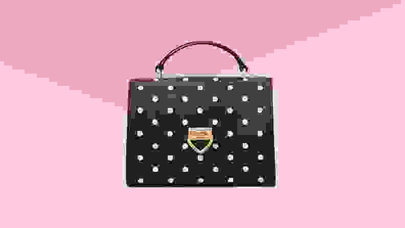 Black and white polka dot top handle purse.