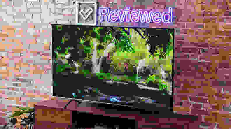 A television set with screensaver of a nature scene.