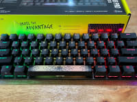 An overhead shot of a small keyboard with black keys.