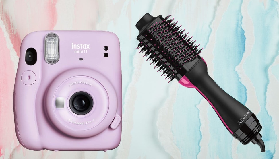 A pink Fujifilm camera and a Revlon curling hair brush.