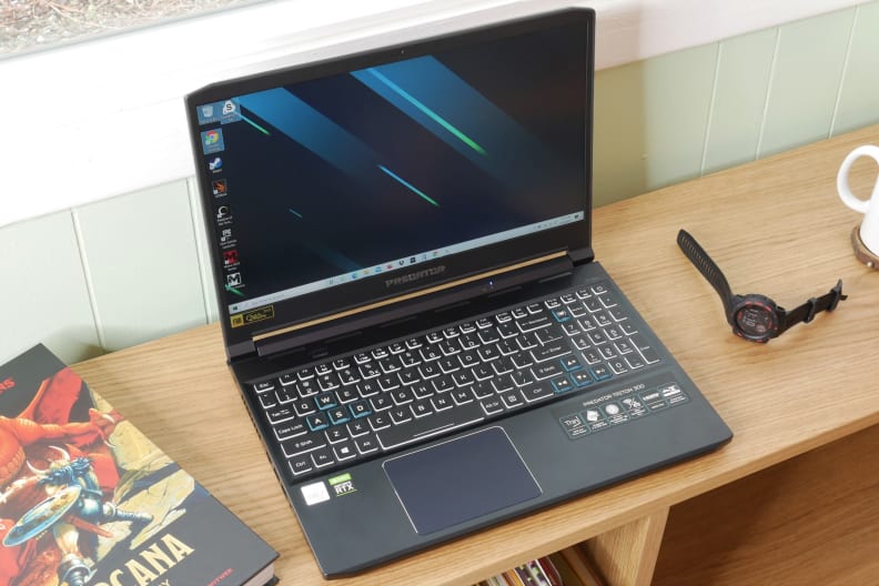 A photo of the Acer Predator Triton 300 gaming laptop open on a bench from above