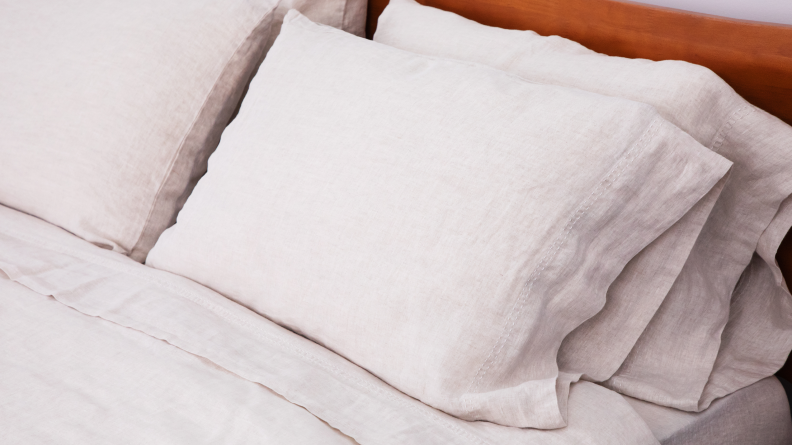 linen pillows on top of duvet on bed