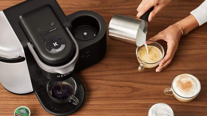 black coffee machine on wooden table