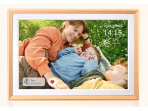 Two women laying on a couch in a picture on digital photo frame