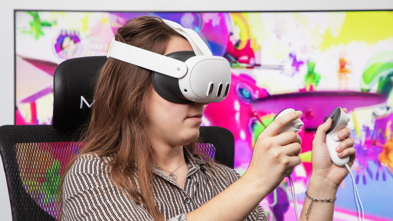 A woman wearing a Meta Quest VR headset and holding controllers.